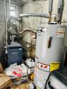 Utilities featuring water heater and a heating unit