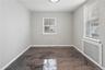 Room featuring a contemporary metallic epoxy floor, neutral painted walls, and white baseboards
