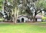Front of home with circular driveway.