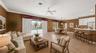 Family room, breakfast nook, & kitchen opening up to the screened lanai. (virtually staged)