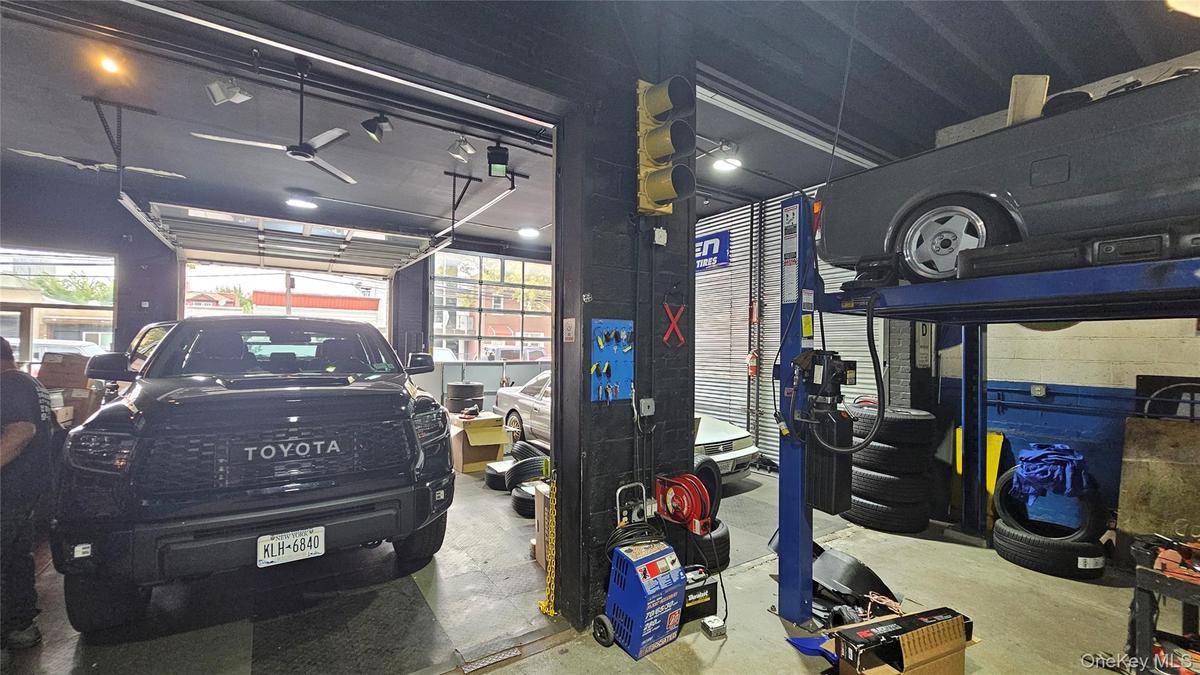 Garage featuring a ceiling fan