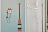 Primary_bathroom_door_with_updated_shower_enclosure