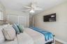 Bedroom 2 with sliding glass door to pool