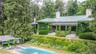 View of swimming pool featuring a diving board and a patio area