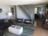 Living room with hardwood / wood-style floors and stairs