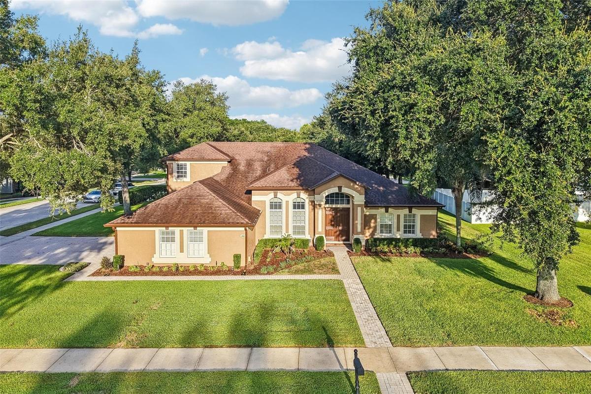 Welcome to one of Wekiva Run's most sought-after floor plans, offering exceptional space, flexibility, and timeless style on a beautifully landscaped 