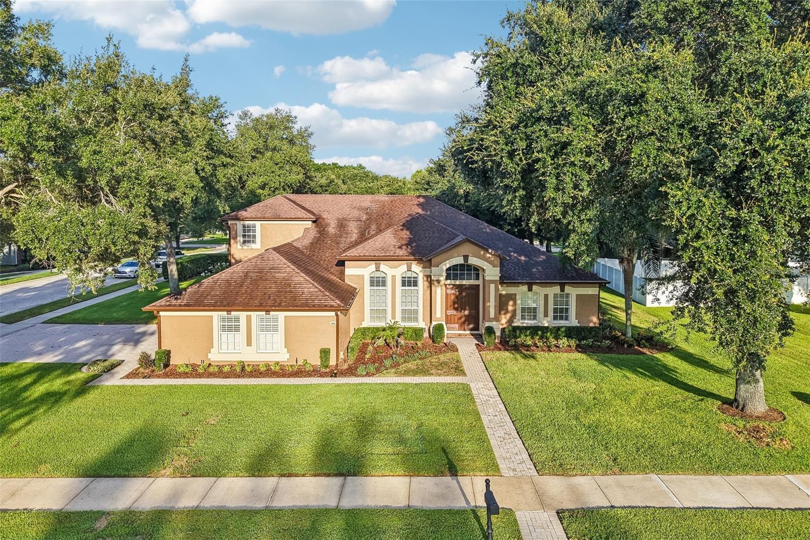 Welcome to one of Wekiva Run's most sought-after floor plans, offering exceptional space, flexibility, and timeless style on a beautifully landscaped 