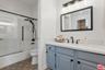 Bathroom featuring a grey vani