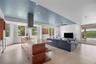 At the heart of the home, the kitchen opens effortlessly to the family room and den, creating a warm and functional gathering space. An expanded pantr