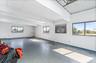 Unfurnished room with healthy amount of natural light, a skylight, and concrete floors