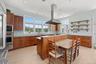The Perfect Kitchen with Glass Doors Leading to Pool Area