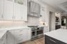The kitchen is flooded with natural light and views of the pool!