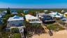 Aerial view of home showing steps to beach