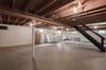Basement with stairs and separate washer and dryer