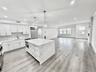 585 MAIN STREET, ARMONK, NY 1A SLEEK, OPEN CONCEPT KITCHEN WITH CENTER ISLAND AND PROFESSIONAL VIKING APPLINACES