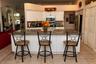 Oversized island with countertop overhang and extra cabinet storage