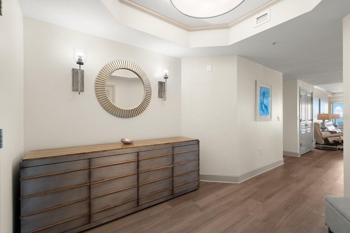 The moment you step through the foyer, the home begins to unfold in a way that feels both welcoming and effortlessly refined.