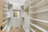 Spacious closet with light wood-type flooring