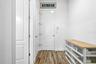 Step in from the garage and find a convenient drop zone—laundry room just to the left for easy access and organization!