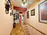 Stairs leading to the second floor. Access to the 10th floor from here. Built in unit at base of the stairs