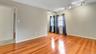 Empty room with baseboards, light wood finished floors, visible vents, and track lighting