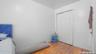 Unfurnished bedroom featuring wood finished floors and a closet