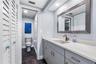... Full Bath on Main Level  Between Kitchen Area and 2nd Guest Bedroom.