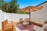 Deck in the backyard, on the left side.