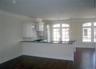 Eat in kitchen with long bar counter facing the dining area & living room... just add your bar stools...