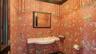 Designer powder room with gold-leaf ceiling