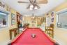 Another view of the game room with plenty of space for a pool table.