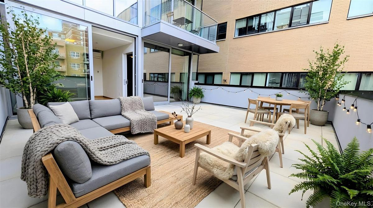View of patio featuring an outdoor living space and outdoor dining area