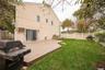 Patio and yard, fenced. Sliders leading from Den to patio.