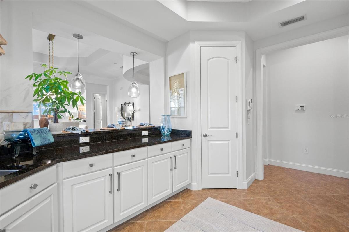 Partial Kitchen, looking toward pantry closet and breakfast bar.