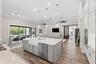 The kitchen opens out onto the main living space and second dining area.