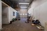 garage bay #2 of the commercial building. There is access within this space to all the utilities for each unit in this building.