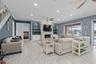 Family Room with custom stone fireplace, tile throughout the main floor, this whole home has been completely remodeled to perfection.