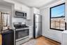 2nd Floor Apartment Kitchen w/ stainless steel appliance (electric stove and refridgerator).