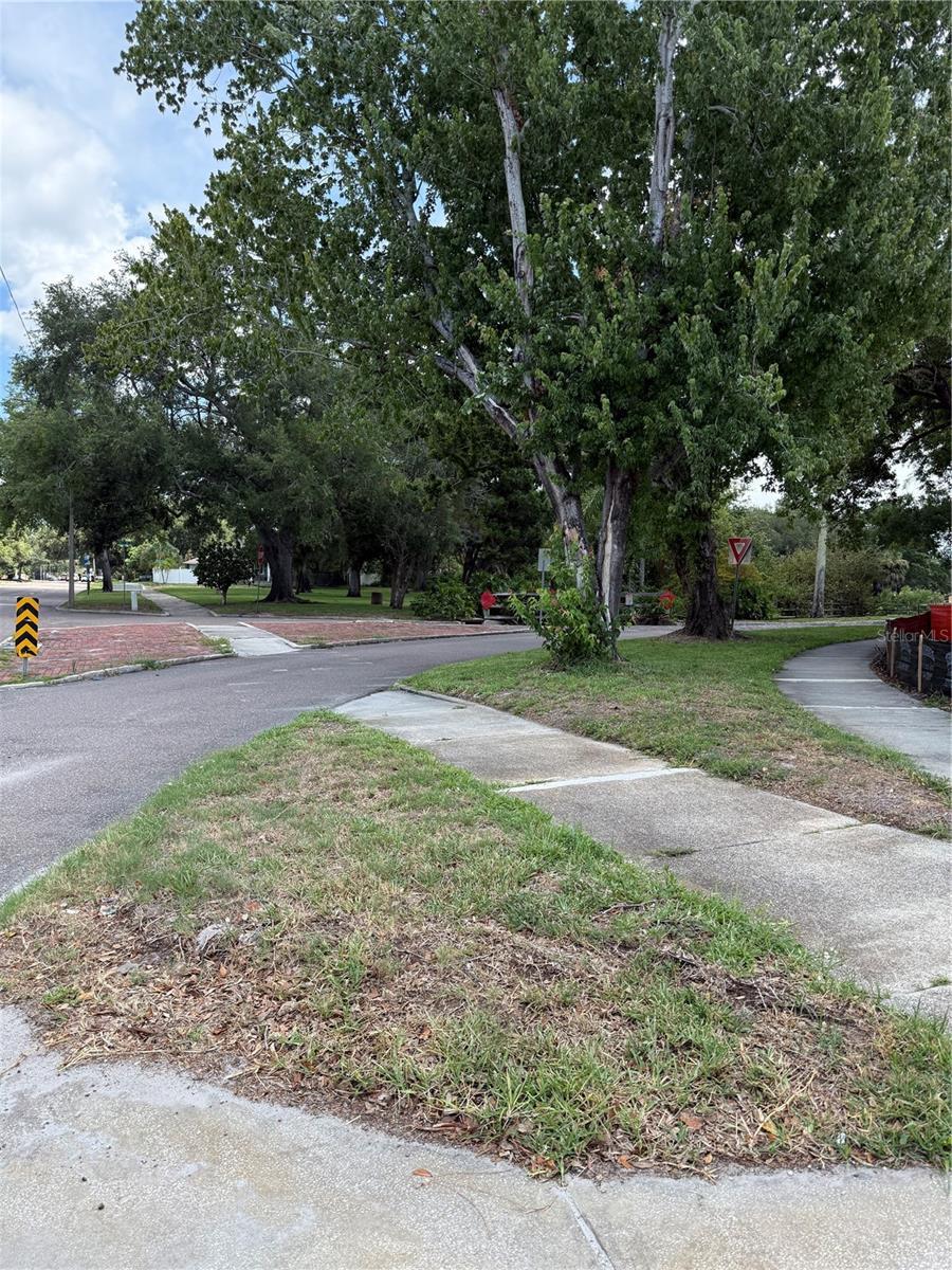 Pie shaped home site with sidewalk