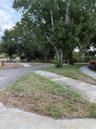 Pie shaped home site with sidewalk