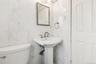 Bathroom with tile walls and toilet