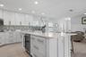Breakfast bar island with wet bar and beverage fridge