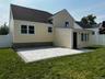 Rear view of house with a patio and a shingled roof