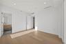 Unfurnished bedroom featuring wood finished floors, recessed lighting, and connected bathroom