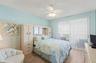 Sliders open to your private balcony overlooking the ocean in the primary bedroom as well as the living room