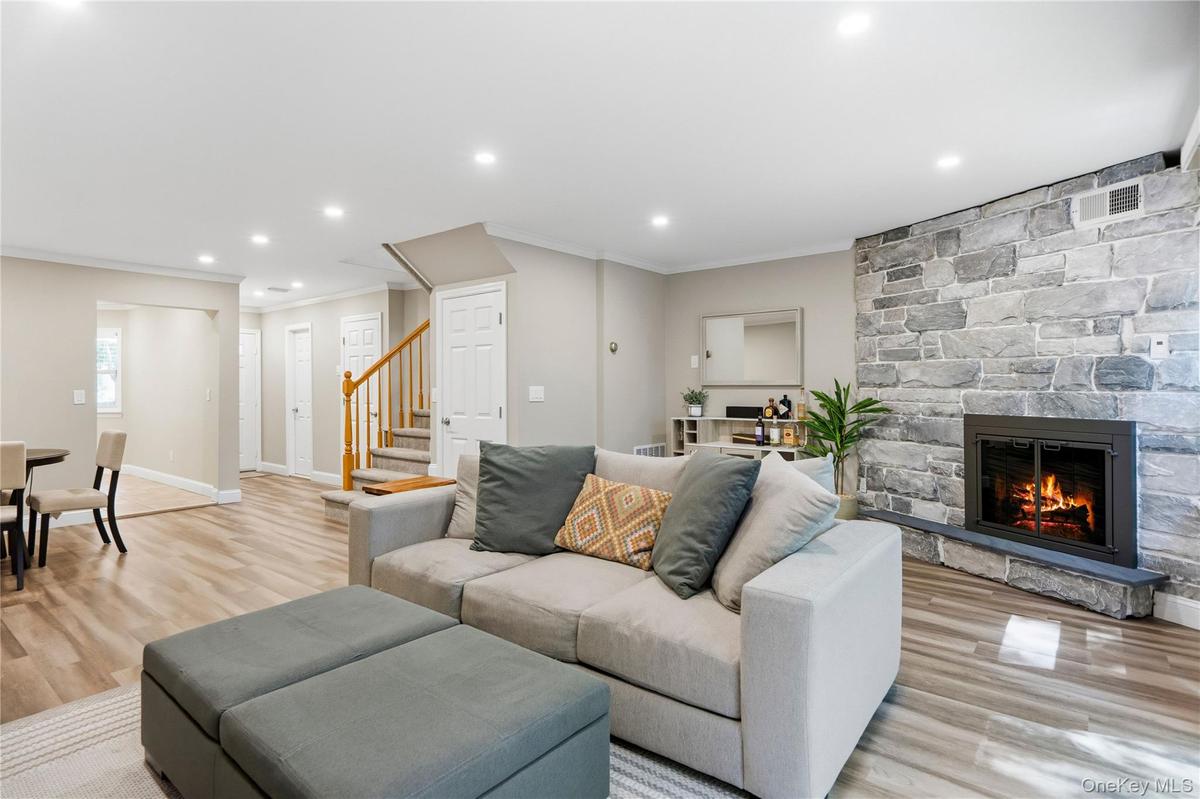 View of living room towards kitchen and entry