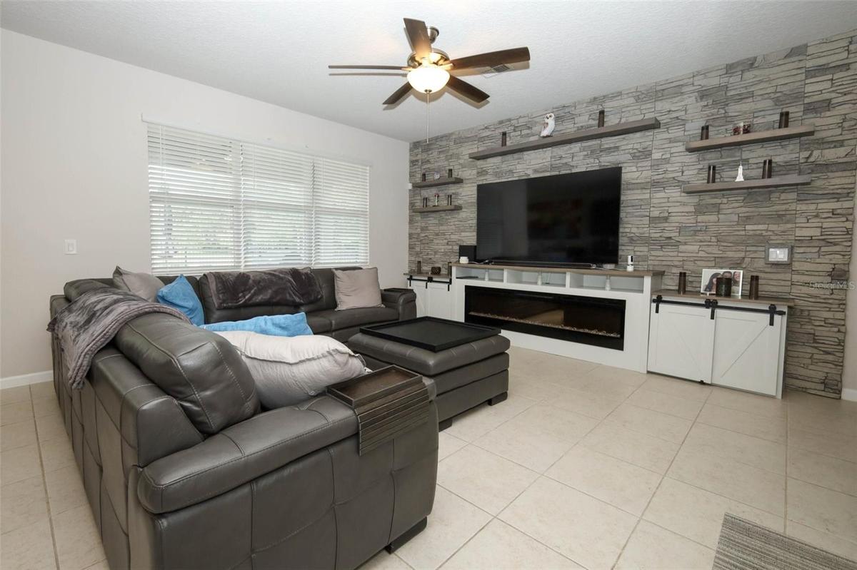 Great room / Custom built entertainment center / electric fireplace