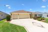 Extended 2 car plus golf cart garage with wide driveway.