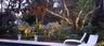 Backyard comes to life at night with all the Landscaping & Lighting owners have added