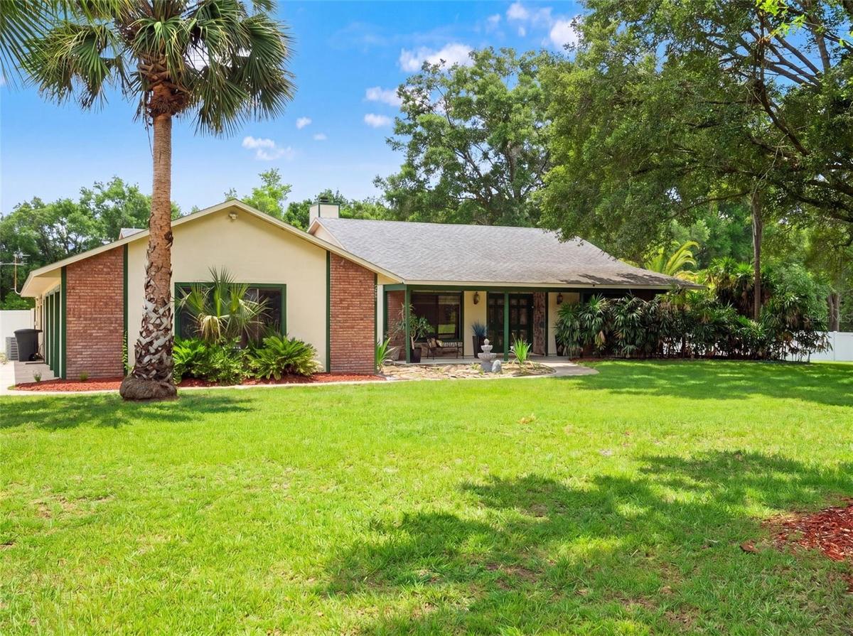 Charming Front Exterior with Expansive Lawn